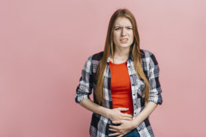 Person with belly pain due to Crohn's Disease